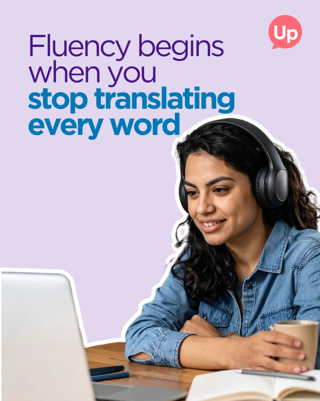 Woman learning English online with headphones, focusing on fluency instead of word translation